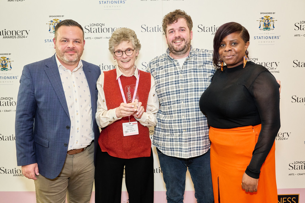 <strong>Above:</strong> <em>Coffeenotes’ Sarah Downey and Jack Downey receive the award from Rob Willis (left) and Chantelle White (right) of Max Publishing.</em>