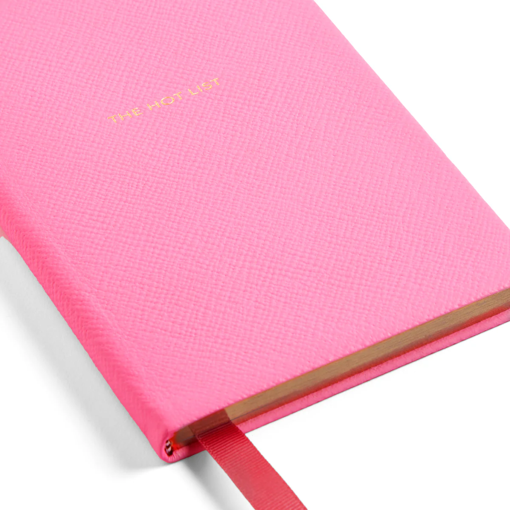 Above: The bubblegum pink notebook is stamped with ‘The Hot List’ in gold.