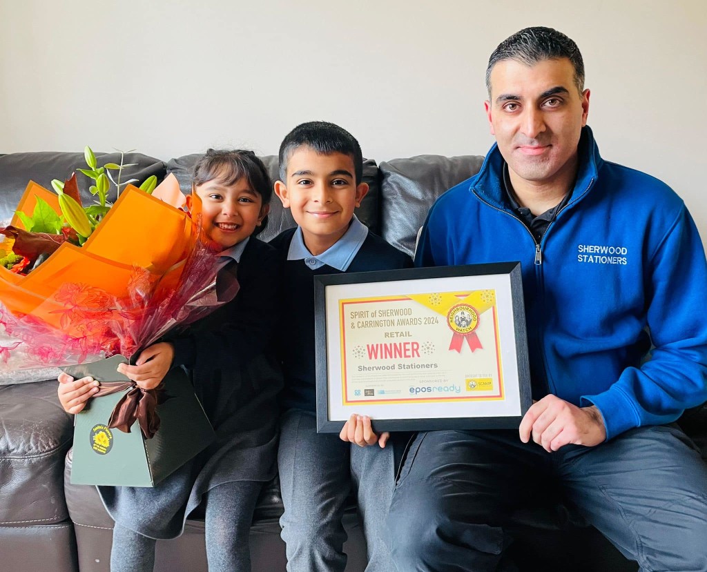 Above: Owner of Sherwod Stationers, Asif Kassam and his children, Zak and Alisha celebrate winning a service to the community award for the third year in a row.