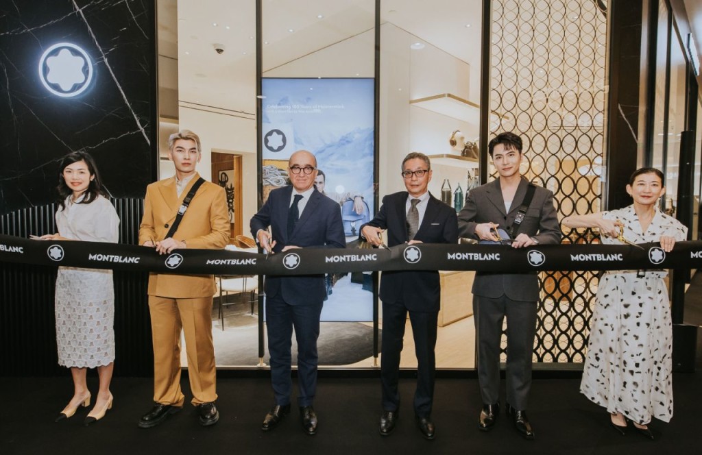 Above: Cutting the ribbon at the new boutique at the Takashimaya Shopping Centre in Singapore.